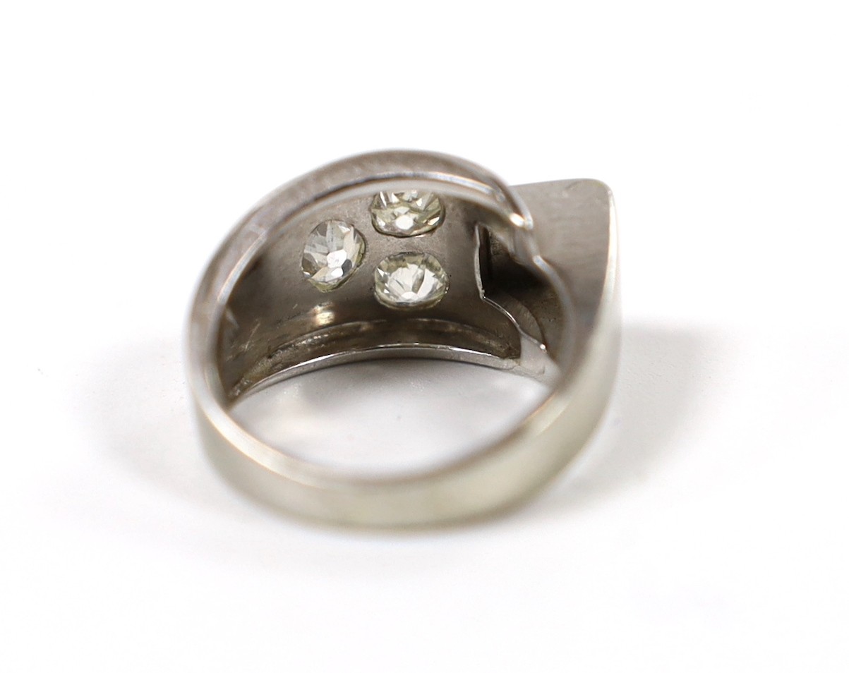 A continental 750 white metal and four stone diamond set dress ring, size H, gross weight 6.1 grams.